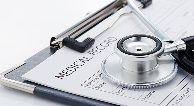 Medical records and stethoscope